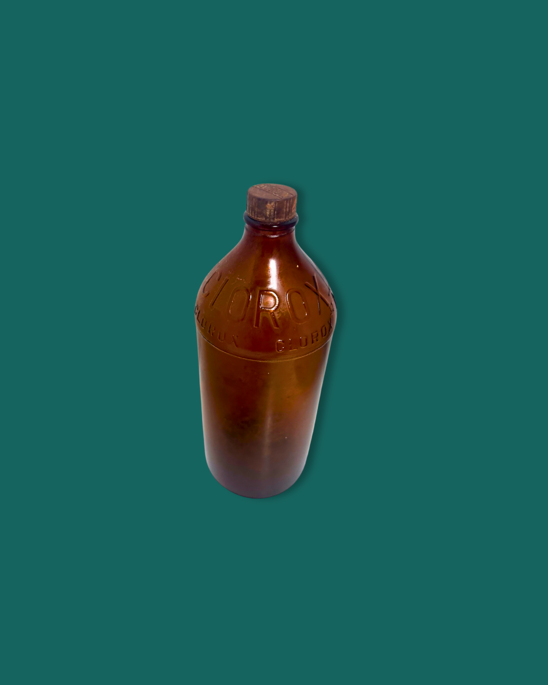 Brown bottle with cap on a green background