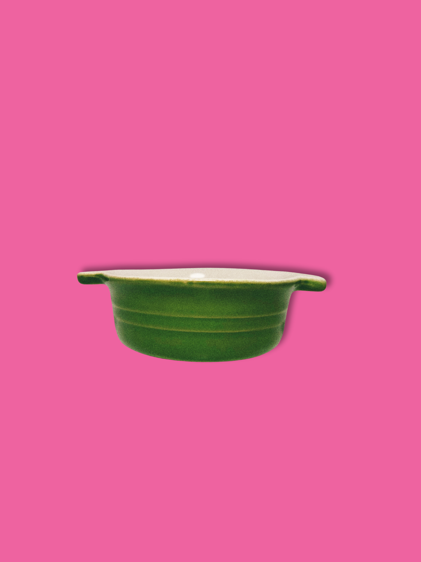 Small Green Baking Dish on pink background.
