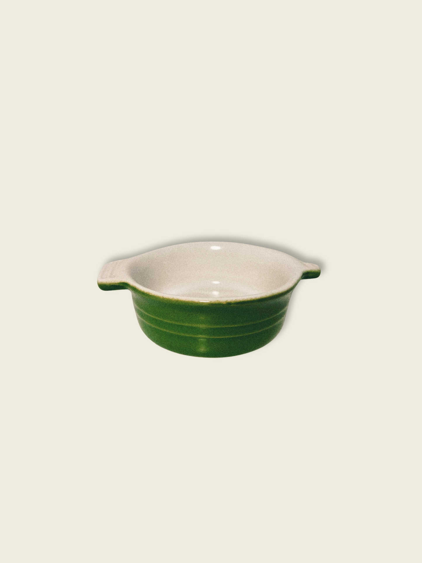 Small green baking dish on white background