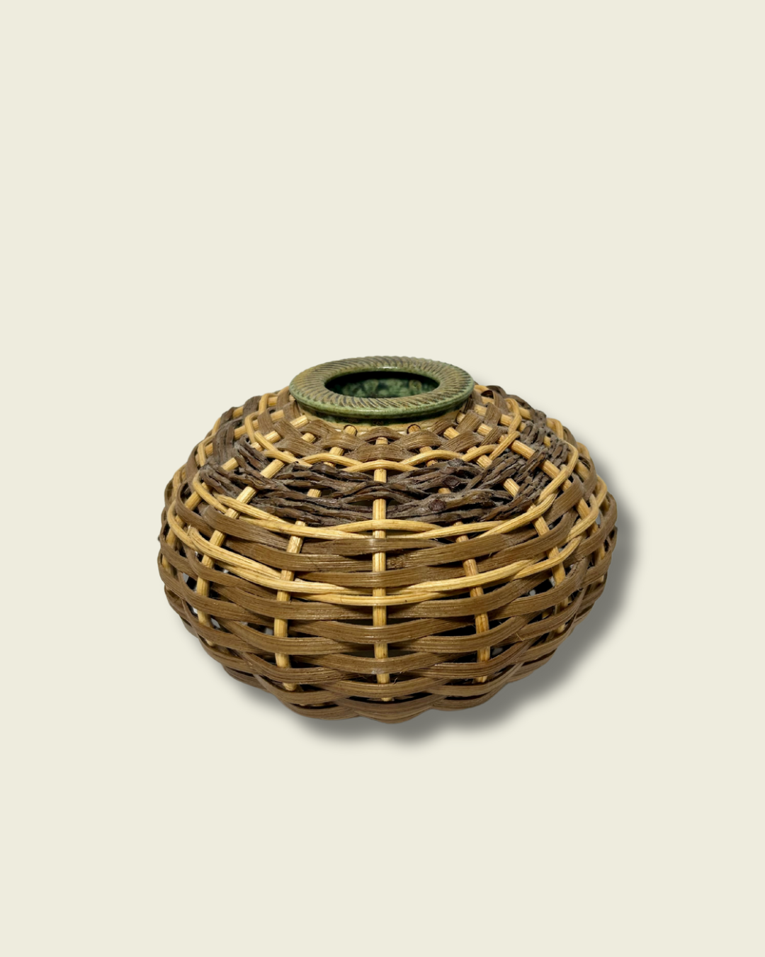 Woven basket with a circular design on a beige background