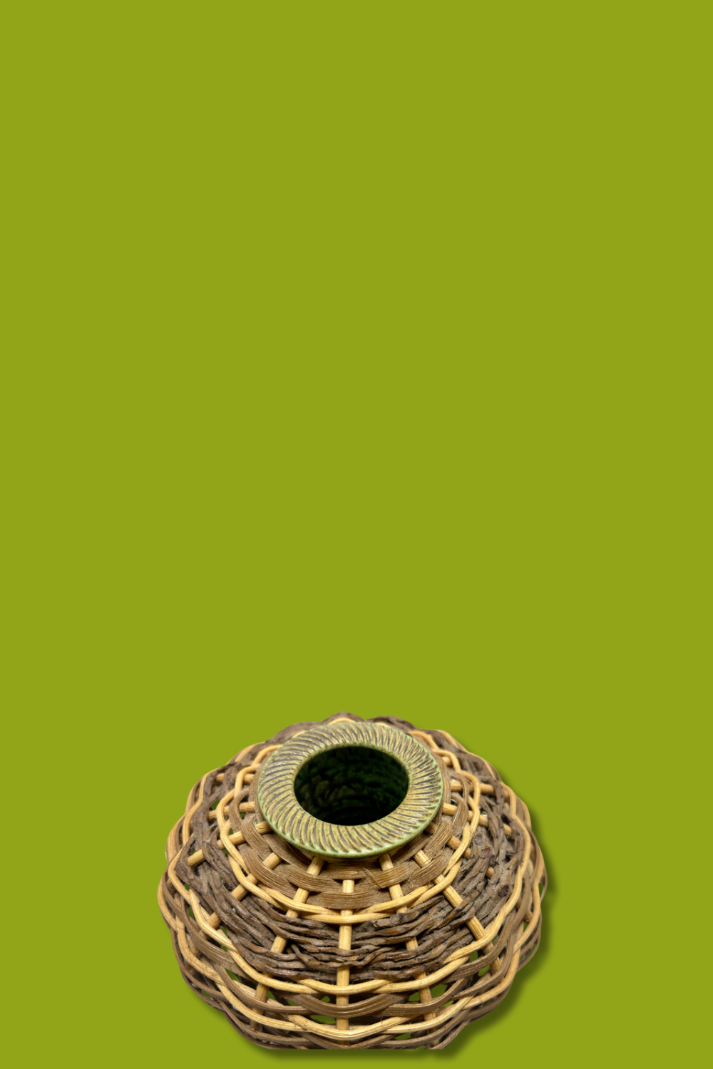 Woven basket on a solid green background