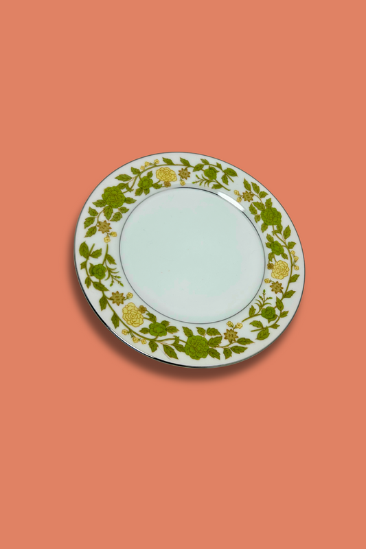 Decorative plate with floral pattern on a coral background