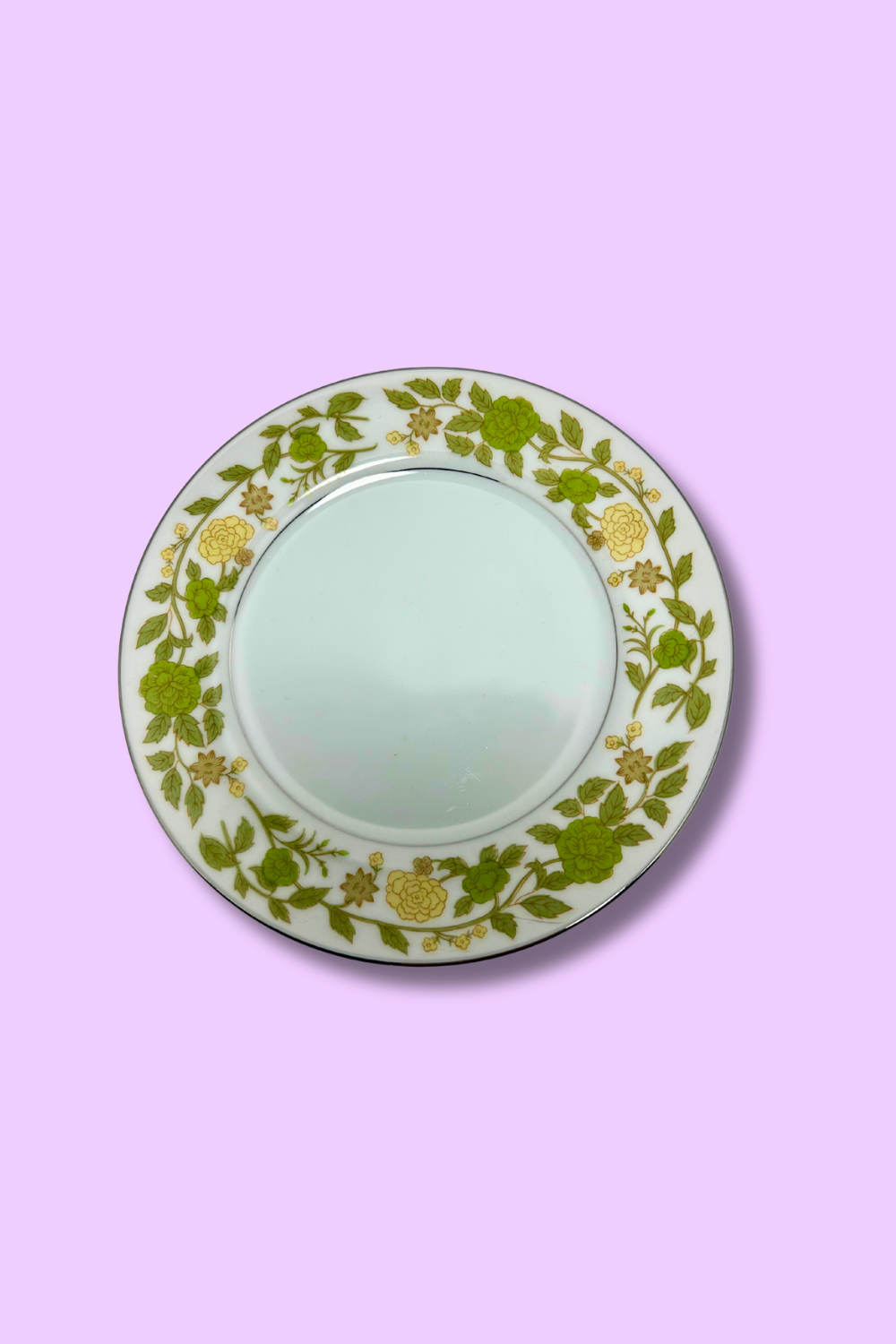 Decorative plate with floral pattern on a pink background