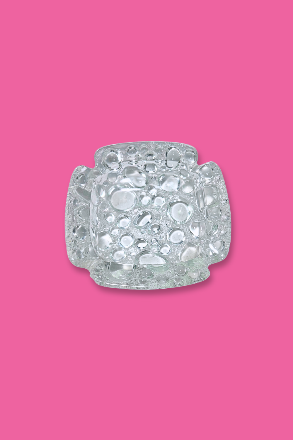 Decorative crystal object on a pink background