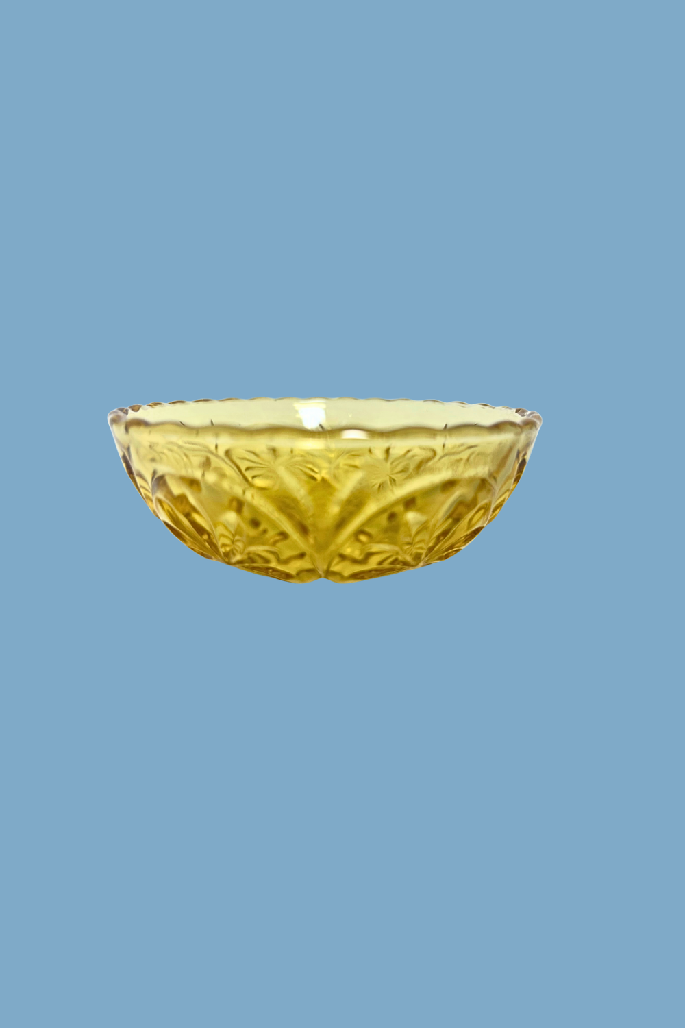 Gold decorative bowl on a blue background