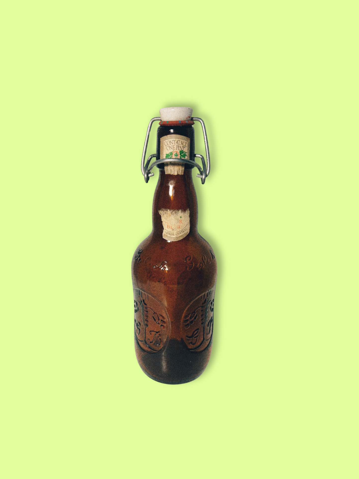 A vintage Grolsch beer bottle with a brown tint and decorative patterns, featuring a white cap and a label that partially shows the brand name.