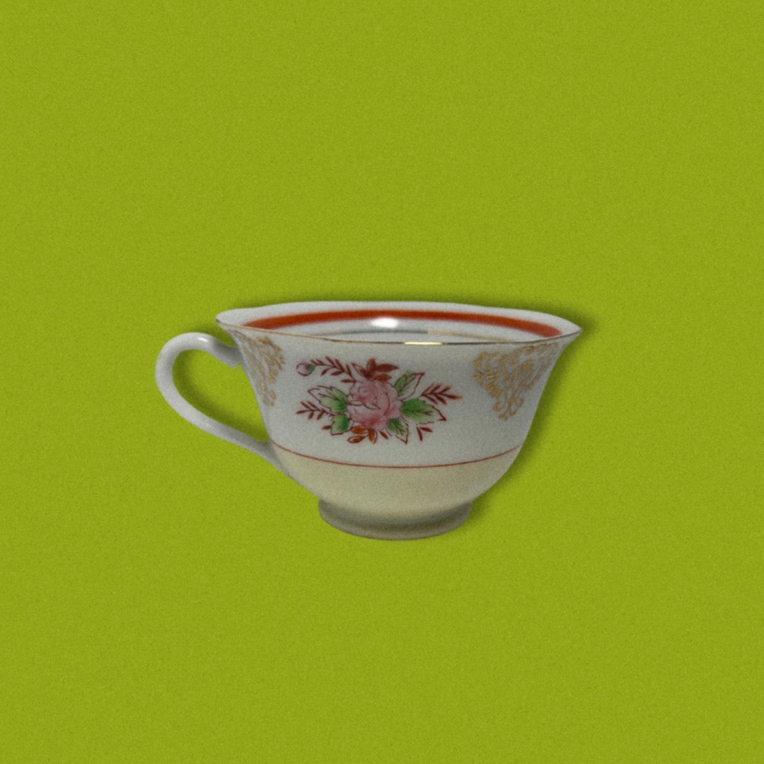 Photo of vintage japanese tea cup on green background.