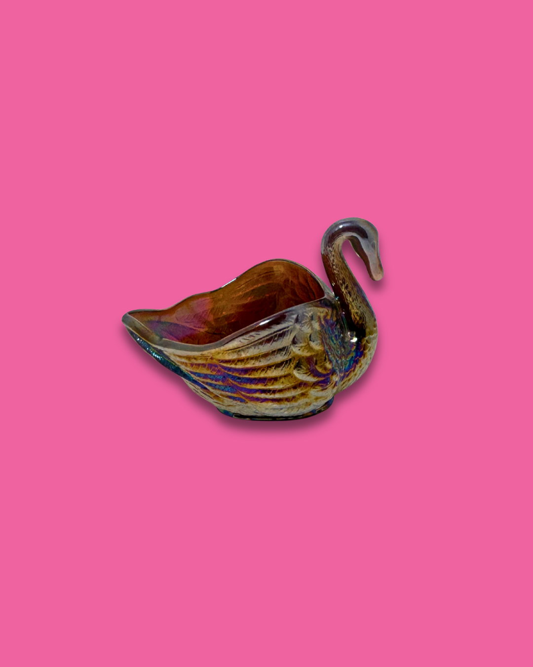 Ceramic swan-shaped dish on a pink background