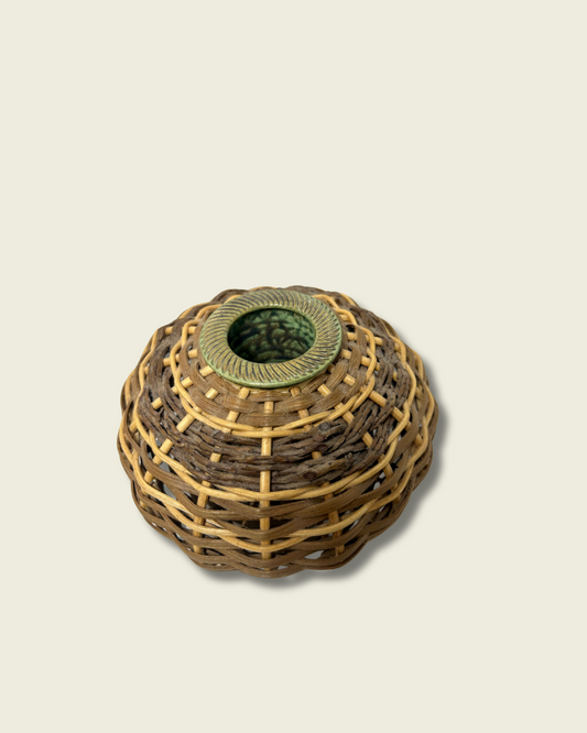 Woven basket with a circular opening on a beige background