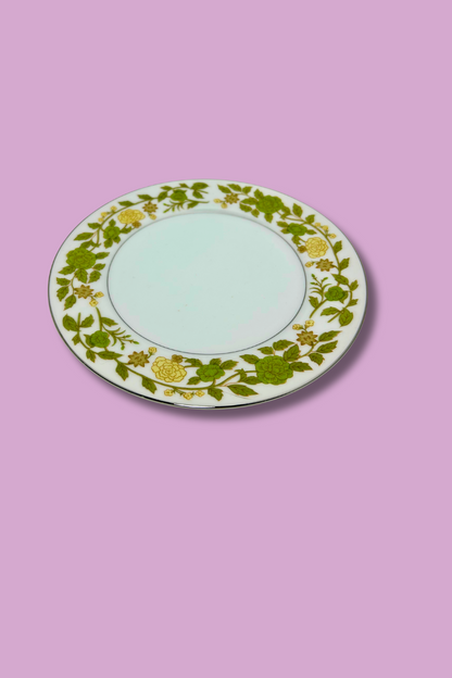 Decorative plate with floral pattern on a pink background