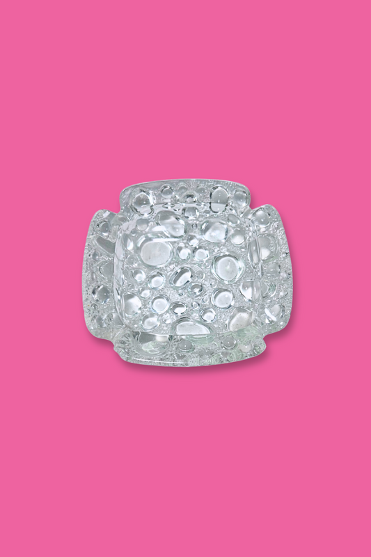 Decorative crystal object on a pink background