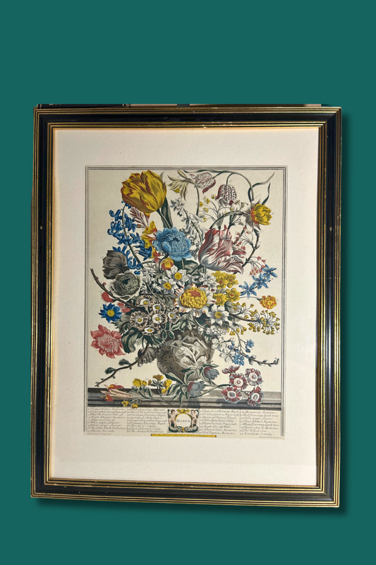 Framed artwork of a floral arrangement on a green background