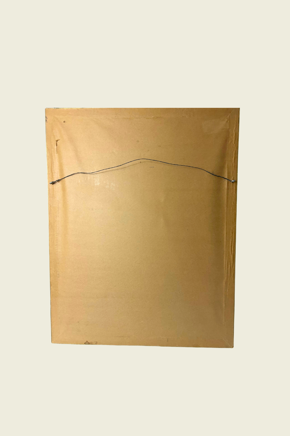 Gold-colored envelope with a black string on a beige background