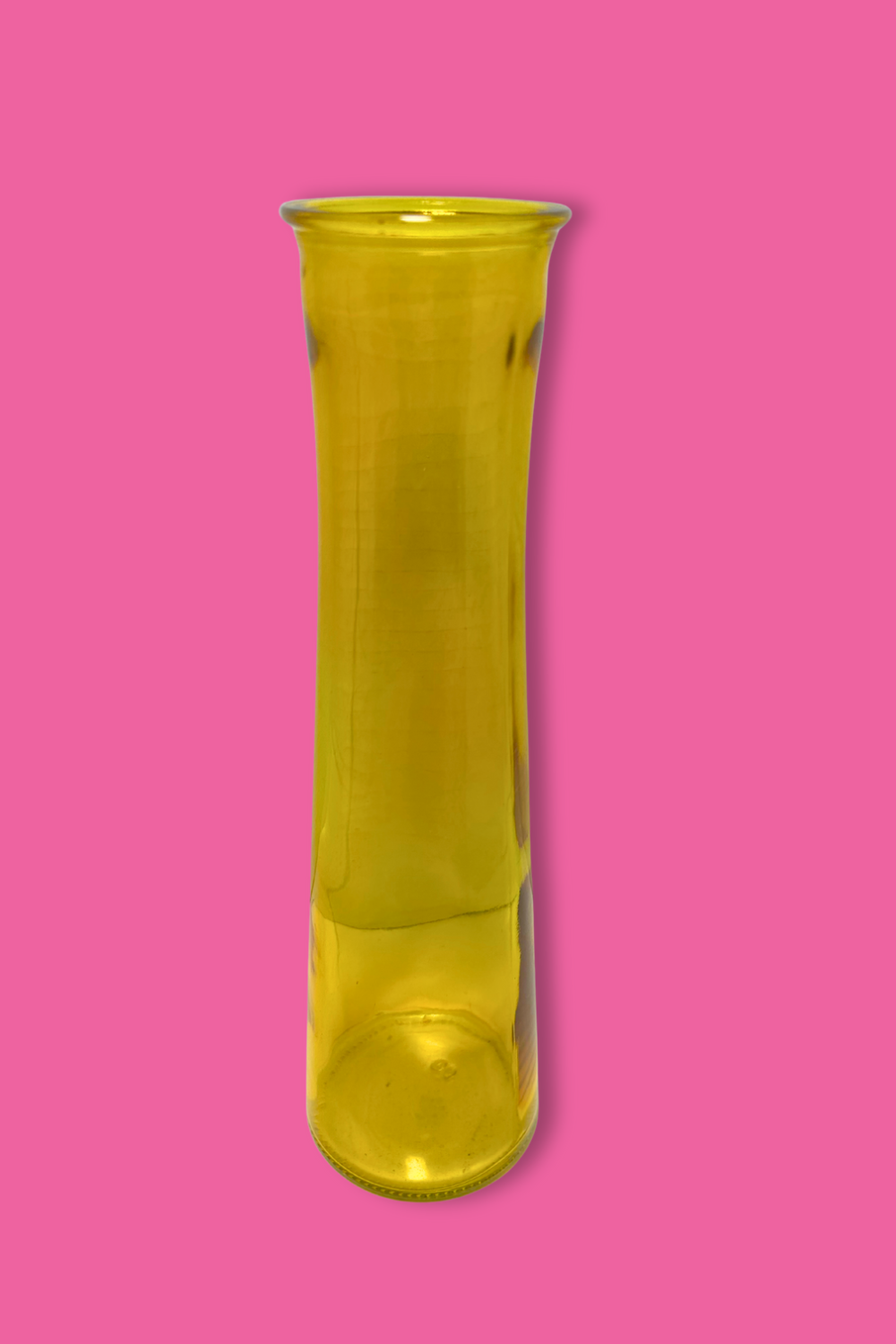 Yellow glass vase on a pink background