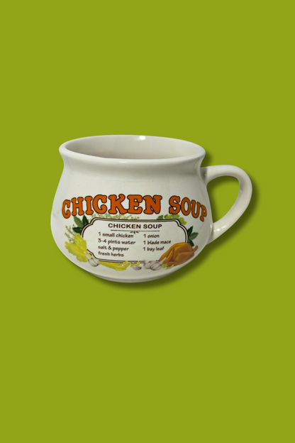 White mug with 'Chicken Soup' text on a green background
