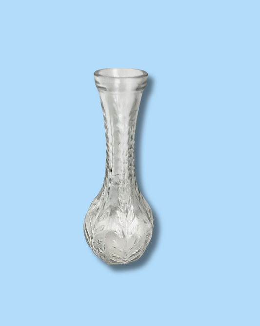 Clear glass vase on a light blue background