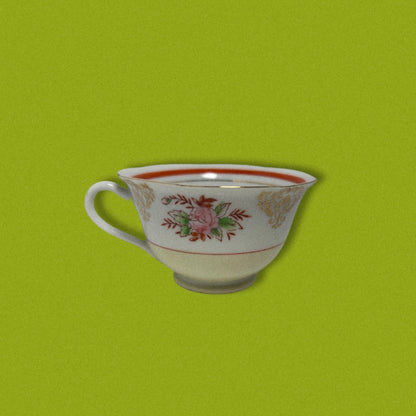 Photo of vintage japanese tea cup on green background. 