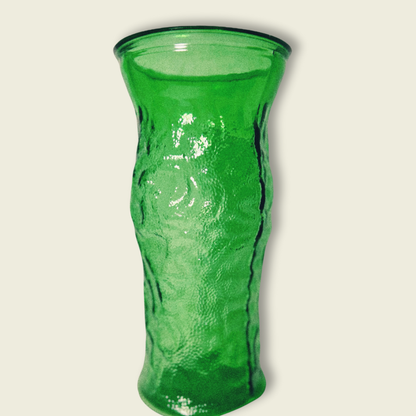A vintage emerald green glass vase with a textured surface, featuring a classic hoosier design.