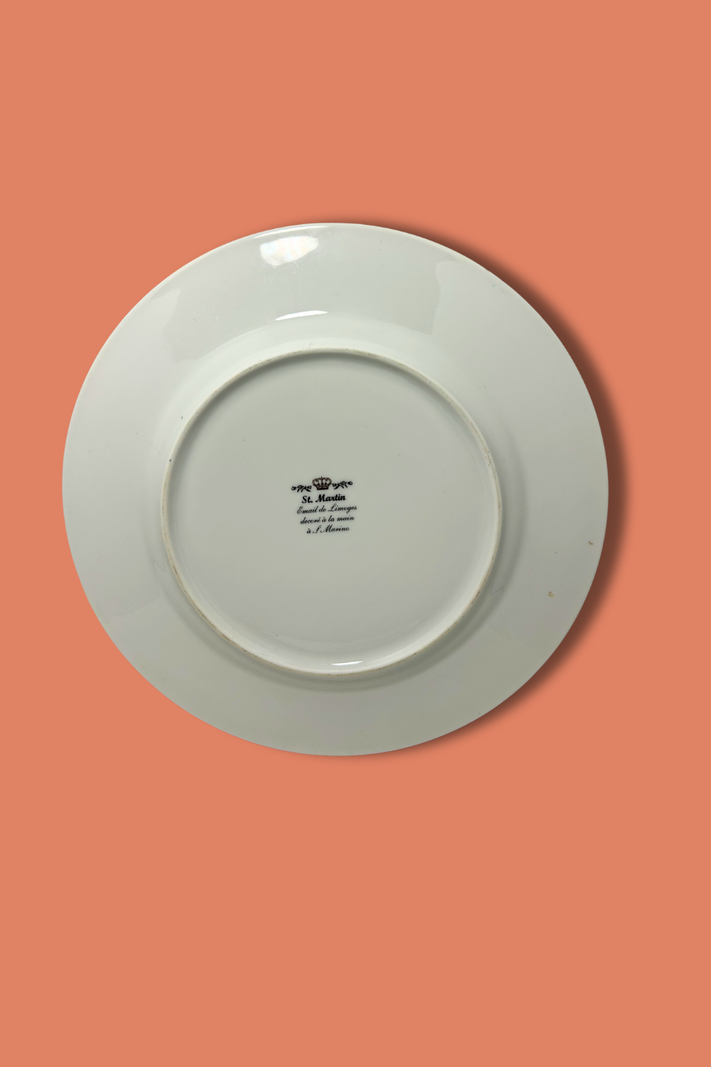 White plate with text on a peach-colored background